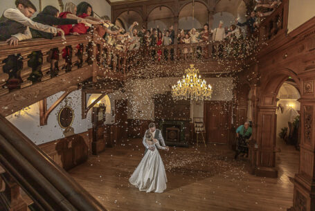 Tanya and Shane's first dance with confetti being showered over them by their guests at Holmewood Hall