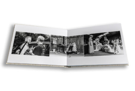 Black and white wedding album images taken at the Tractor Barn in Northamptonshire by John Fox
