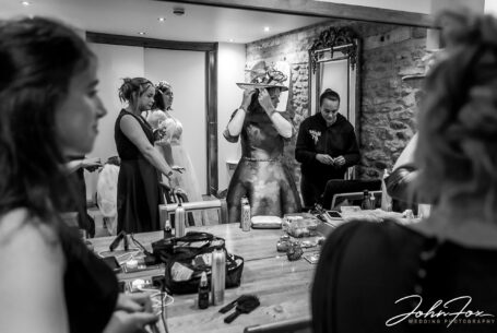 The Bridesmaids prepare to leave for the ceremony at Dodford Manor, Northamptonshire. Image by John Fox