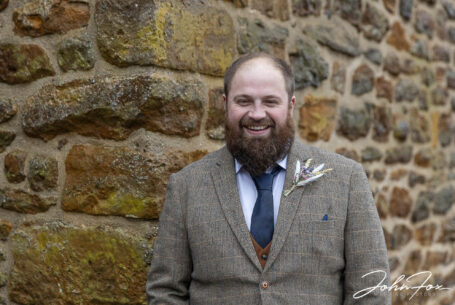 Daniel the groom awaiting his bride for their wedding at Dodford Manor, Northamptonshire.