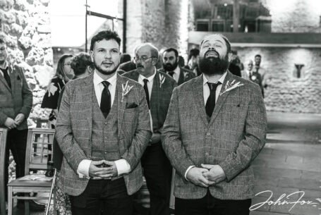 Groom and bestman nervously waiting for the bride at Dodford Manor, Northamptonshire. Candid photo by John Fox