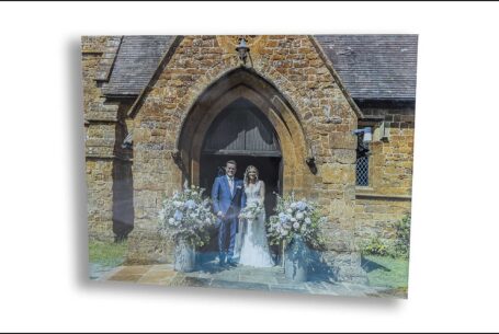 Lauren and Jake’s wedding album box. The cover has an image of the couple outside the Oxfordshire church on their wedding day.