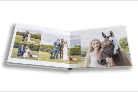 Lauren and James with their dogs and Lauren's horse on their wedding day at Primrose Hill, Oxfordshire