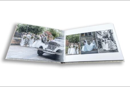 Amy, the bride, arriving at her Wedding Ceremony at Leicester Guildhall in a white vintage car. Part of the images that make up a stunning wedding album from John Fox