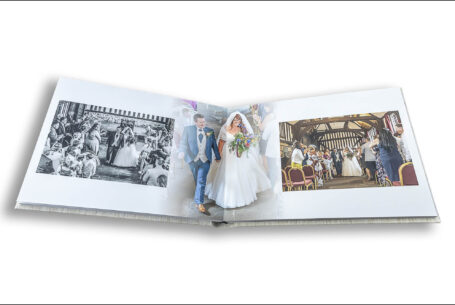 Wedding album images of newly-weds Amy and Karl walking up the aisle after their ceremony at the historic Guildhall, Leicester