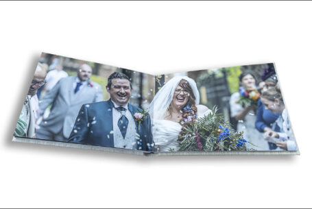 Wonderful image from Amy and Karl’s Wedding Album of the couple being showered in confetti by their guests.