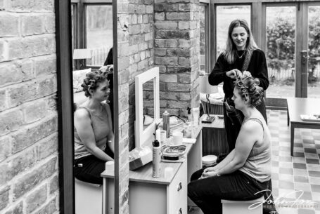 Sophie having her hair styled ready for her wedding day at Hothorpe Hall, Northamptonshire