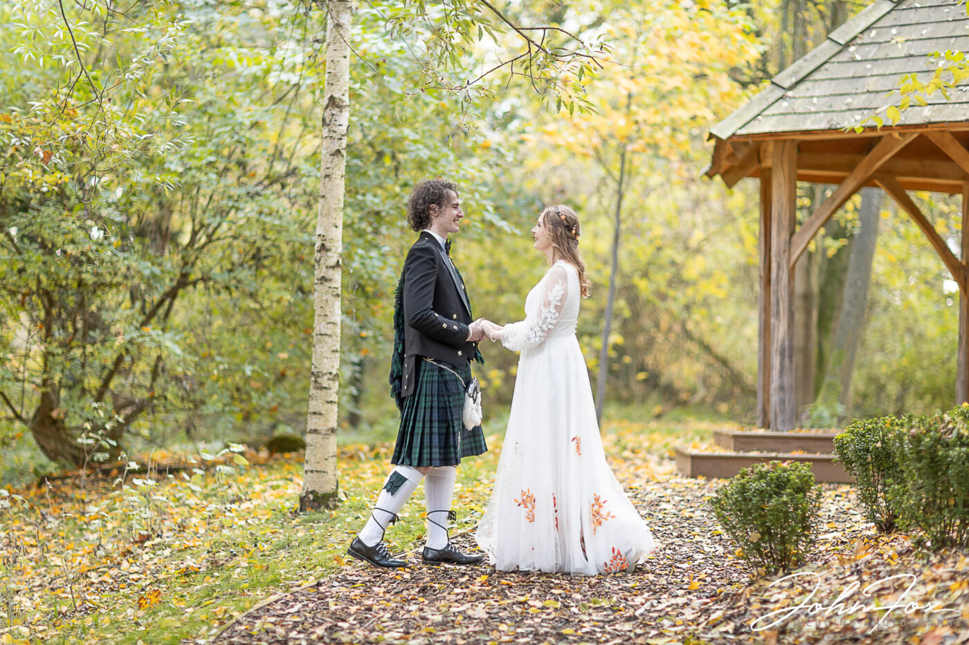 Sophie and Jack on their wedding day in the woods at Hothorpe Hall. Wedding Photographer Hothorpe Hall Northamptonshire.