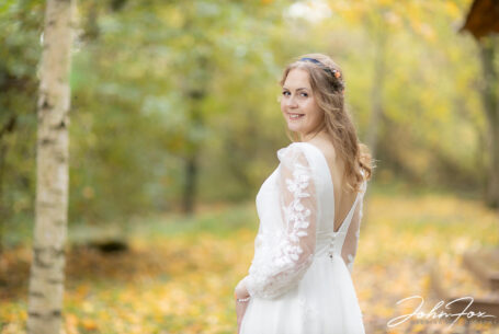 Sophie, the bride, in the woodlands at Hothorpe Hall, Northamptonshire