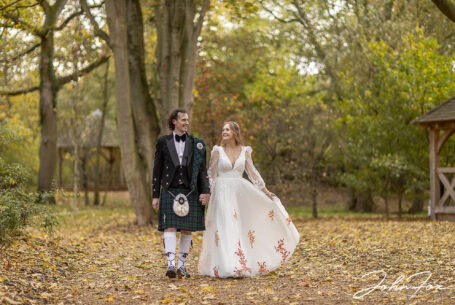 Sophie and Jack walking in woodland at Hothorpe Hall, Northamptonshire