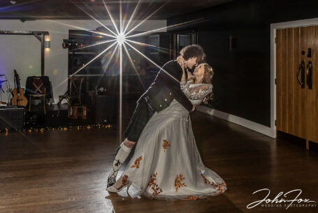 Jack holding Sophie in his arms for their first dance at their Hothorpe Hall wedding celebrations.