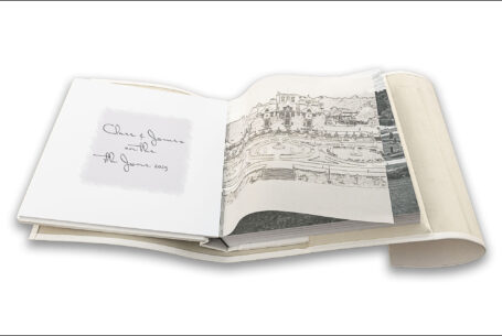Wedding album showing images from the speeches and translucent page with a line drawing of the venue placed on top of the printed image. The Tramontina by John Fox Wedding Photography