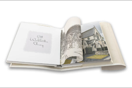 Wedding album showing images from the speeches and translucent page with a line drawing of the wedding venue placed on top the printed image by John Fox