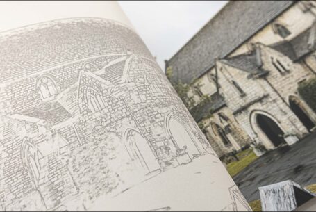 Up close wedding album image of the translucent page with a line drawing of the venue placed on top the printed image by John Fox Wedding Photography