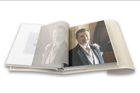 Wedding album showing translucent page printed with an image of James, the groom, in perfect register to the image of him underneath by John Fox Wedding Photography