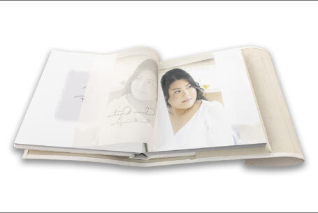Wedding album showing translucent page printed with an image of the bride, Clare, in perfect register to the image underneath - The Tramontina wedding album