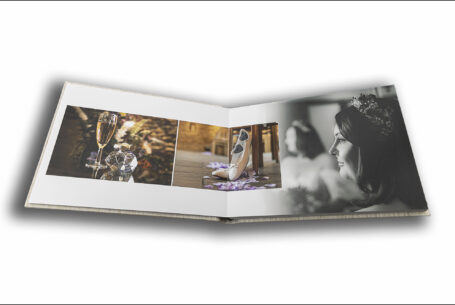 Abigail and Daniel’s Dodford Manor Wedding Album opened at pages showing images of the bride and detail shots.