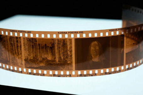 Close-up of 35mm negative film on a light box. Professional Wedding Photographer, John Fox
