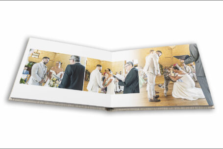 Wedding album images show the wedding ceremony and couple's dog who brought the rings to them at Kingscote Barn
