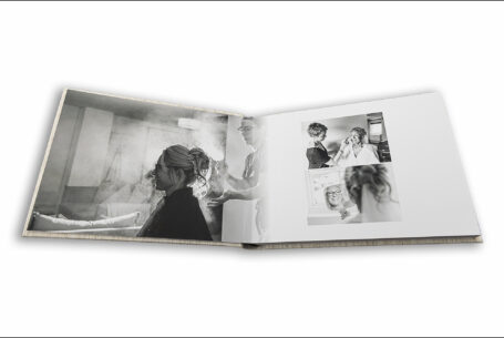 Wedding album open showing page design of bridal preparations in Leighton Buzzard, Bedfordshire. John Fox Wedding Photography.