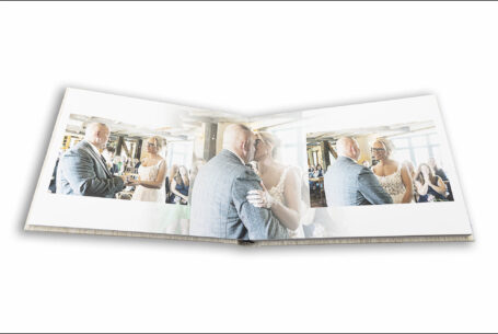 Wedding album open showing images of Lynn and Ian’s Wedding Ceremony in Leighton Buzzard at The Five Bells pub in Stanbridge