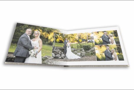 Open wedding album showing page layout of bride and groom images in the grounds at their Leighton Buzzard wedding, Bedfordshire.
