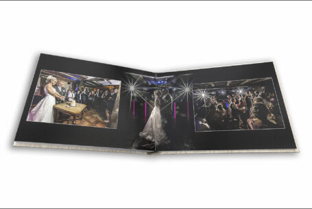 Wedding album showcasing Lynn and Ian’s Wedding with the cutting of the cake and first dance images. Photo by John Fox Wedding Photography.