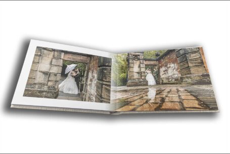 Sarah and Lewis in the grounds at Keele Hall in Staffordshire. Wedding album images by John Fox Wedding Photography.