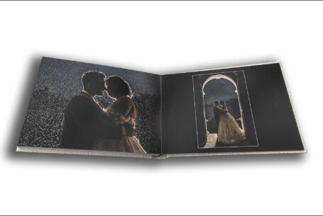 Evening images of Sarah and Lewis kissing in the rain at their Keele Hall wedding. Wedding album created by John Fox Wedding Photography.