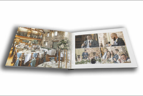 Open wedding album showing images of the speeches for Joanne and James's Wedding at The Ashes Barns in Staffordshire.