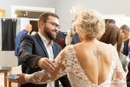 Congratulations from wedding guests at Rushton Hall. Joanne receiving a hug.