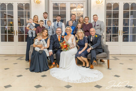Formal wedding group image by John Fox inside Rushton Hall in Northamptonshire