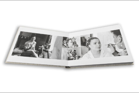 Wedding album open showing page design with images of the bridal preparations. Wedding photography Packages Bedfordshire from John Fox