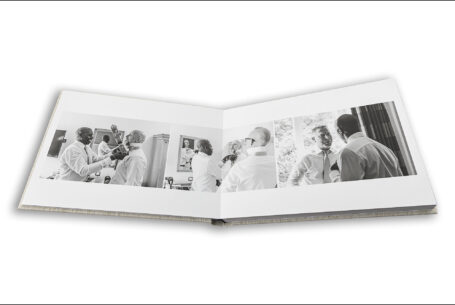 Wedding album open showing page design with images of the grooms preparations. Wedding photography Packages Bedfordshire from John Fox