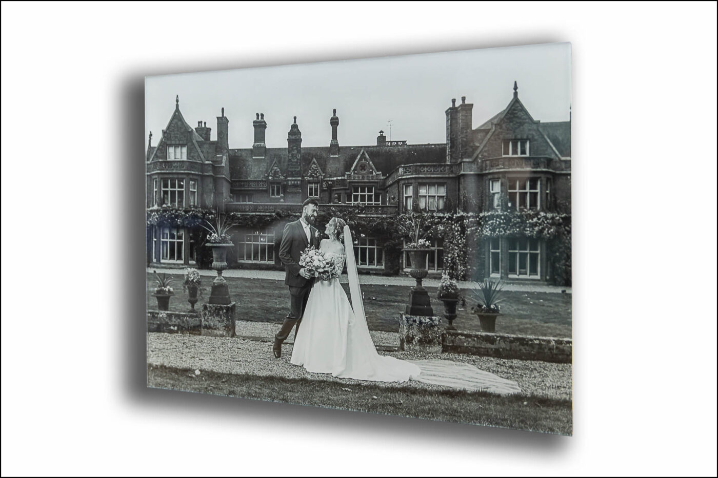 Tanya and Shane’s Wedding Album cover. The newly weds with Cambridgeshire's Holmewood Hall in the background.