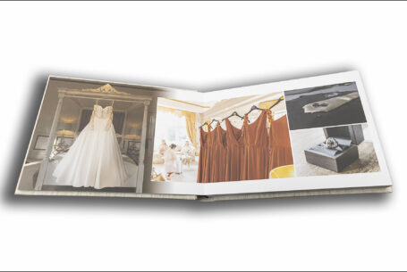 Tanya and Shane’s Holmewood Hall Wedding album opened at a page showing the wedding dress, bridesmaid dresses and groom details