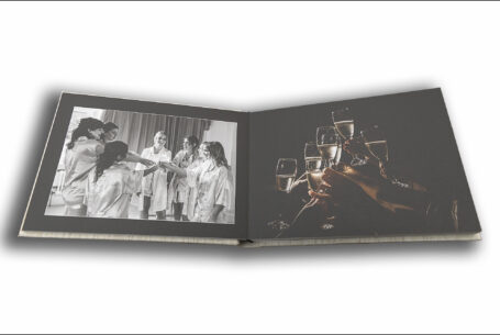 Tanya and Shane’s Holmewood Hall Wedding album opened at a page showing the bride and bridesmaids and also Fabian Perez inspired glasses shot