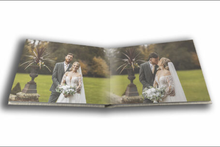 Tanya and Shane’s Holmewood Hall Wedding album opened at a page showing John Fox's images of the bride and groom in the venue's grounds