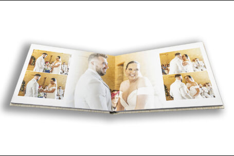 Exclusive Wedding Album opened at the pages of Gabrielle and William kissing at their wedding ceremony at Kingscote Barn in Gloucestershire.