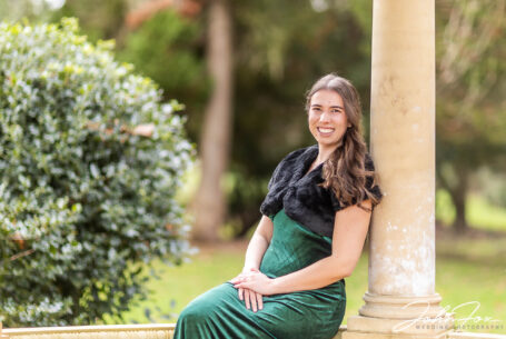 Leicestershire Pre-wedding shoot at Kilworth House. Elly leaning against a pillar in the wedding venue's grounds.