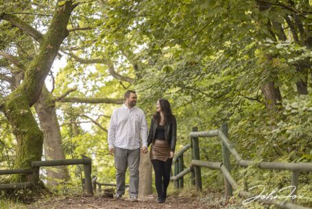 Pre-Wedding Shoot in Staffordshire at Rudyard Lake. The couple-to-be walking in woodlands by the lake.