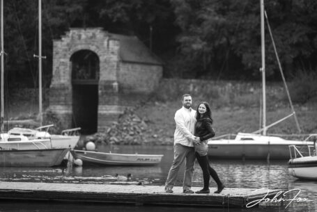 Pre-Wedding Shoot in Staffordshire at Rudyard Lake. Joanne and James surrounded by boats moored on the lake.