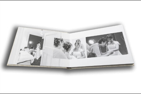 Wedding album by John Fox opened at a page showing bridal preparations at the Putteridge Bury Wedding of Nisha and Marco in Bedfordshire