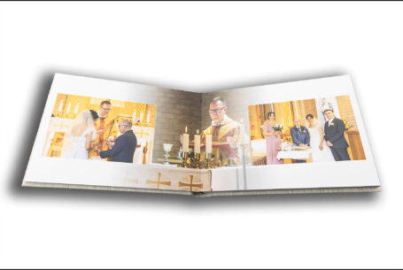 Wedding album by John Fox opened at a page showing the church wedding ceremony of Nisha and Marco in Putteridge Bury