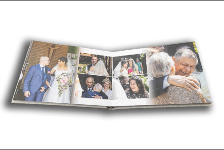 Wedding album by John Fox opened at a page showing images of congratulations after the ceremony at Nisha and Marco's wedding in Putteridge Bury