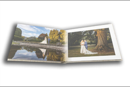 Wedding album by John Fox opened at a page showing images of Nisha and Marco in the grounds at the wedding venue in Putteridge Bury, Bedfordshire