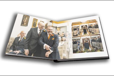 Wedding album by John Fox showing an image of Kevin with his best man sharing a joke before the ceremony at Rushton Hall.
