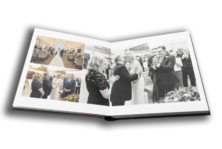 Joanne and Kevin's wedding album opened at a page of images showcasing their wedding ceremony at Rushton Hall