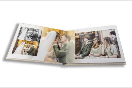 Parents Wedding Album opened at images of Sarah and Lewis's wedding ceremony by John Fox Wedding Photography