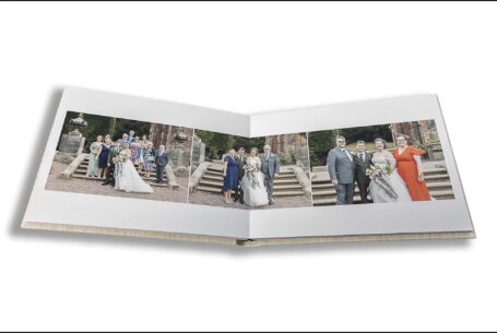 Parents Wedding Album opened at images of Sarah and Lewis outside Keele Hall in Staffordshire. Photo by John Fox Wedding Photography